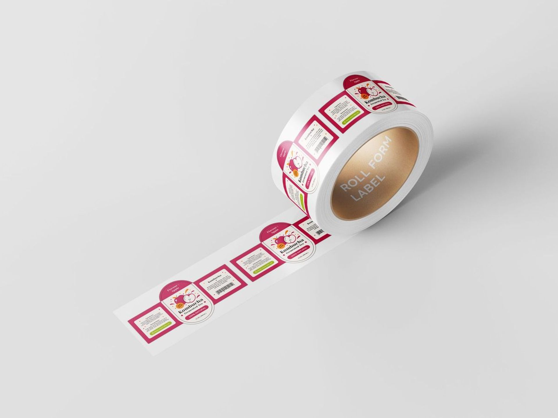 A roll of rectangular product labels with pink designs, partially unrolled on a white surface.